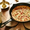 Staub valurautapannu kaatonokalla Ø26 cm, Musta